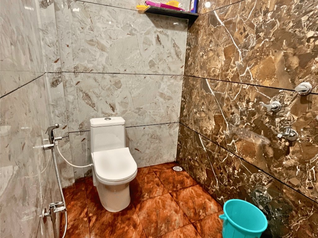 Floor 2 Designer Washbasin and premium red/brown marble walls